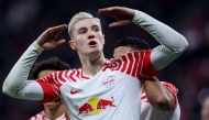 (FILES) Leipzig's Slovenian forward #30 Benjamin Sesko celebrates after scoring the 1-0 opening goal during the UEFA Champions League group G football match between RB Leipzig and Young Boys in Leipzig, eastern Germany, on December 13, 2023. (Photo by Ronny Hartmann / AFP)
