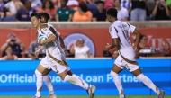 Son Heung-Min #7 of Los Angeles FC and teammate Timothy Tillman #11 celebrates after the team's second goal during the MLS match between Chicago Fire FC and Los Angeles Football Club at SeatGeek Stadium on August 09, 2025 in Bridgeview, Illinois. Geoff Stellfox/Getty Images/AFP 