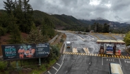 Aerial view of the entrance to the El Teniente mine, a Codelco copper mine in the commune of Machali, near Rancagua, O'Higgins Region, Chile, on August 1, 2025. (Photo by Raul Bravo / AFP)
