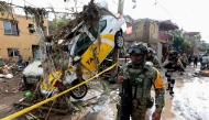 (Files) Army soldiers patrol the area affected by flash flooding due to heavy rains in Zapopan, Jalisco state, Mexico on July 16, 2025. (Photo by ULISES RUIZ / AFP)
