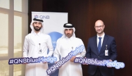 QNB officials pose for a photo during the campaign.