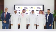 beIN and SMC officials in a group photo during the agreement signing ceremony.