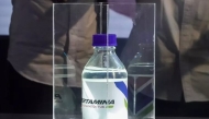 A sample of Pertamina's sustainable aviation fuel made from a mix of used cooking oil is presented during a news conference at a Pertamina refinery in Cilacap, Central Java, on  August 12, 2025. Photo credit: Idhad Zakaria/Antara/social media