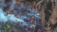 This handout satellite image courtesy of Maxar Technologies taken and made available on August 13, 2025 shows a view of wilfires in Gymnotopos, in the Epirus region of Greece. (Photo by Handout / Satellite image 2025 Maxar Technologies / AFP) 