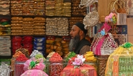 Photo used for representational purposes. A shopkeeper sells dry fruits in Srinagar on August 7, 2025. Indian exporters warned that the cost of additional US tariffs risked making businesses 