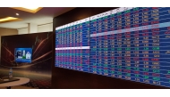 A view of a large screen showing movement in share prices at Qatar Stock Exchange (QSE) trading hall.