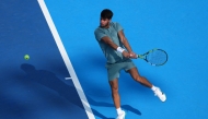 Carlos Alcaraz of Spain plays a backhand during the match against Andrey Rublev during Day 9 of the Cincinnati Open at the Lindner Family Tennis Center on August 15, 2025 in Mason, Ohio. Dylan Buell/Getty Images/AFP