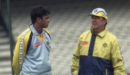 (Files) Debashish Mohanti (L) medium fast bowler for India talks to Bobby Simpson, the Australian coach working with the Indian team during a practice session at the Oval, London, on June 3, 1999. (Photo by Martin Hayhow / AFP)