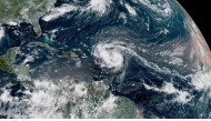 This satellite image provided by the National Oceanic and Atmospheric Administration (NOAA) shows Hurricane Erin forming in the Atlantic Ocean on August 15, 2025. (Photo by Handout / NOAA / AFP) 