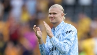 Manchester City's Norwegian striker #09 Erling Haaland applauds at the end of the English Premier League football match between Wolverhampton Wanderers and Manchester City at the Molineux stadium in Wolverhampton, central England on August 16, 2025. (Photo by Darren Staples / AFP)