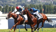 First Look, ridden by James Doyle (front), in action during the race. 