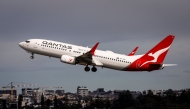A Qantas Airways Boeing 737 aircraft takes off from Sydney International Airport in Sydney on August 18, 2025. (Photo by David Gray / AFP)