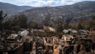A general view of San Vicente de Leira, in the Spanish northwestern province of Ourense is seen after a wildfire on August 19, 2025. (Photo by Miguel Riopa / AFP)
 