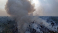 Aerial view of an illegal fire in the Amazon rainforest on the banks of the BR-230 (Transamazon Highway), near the city of Labrea, Amazonas state, northern Brazil, taken on September 4, 2024. (Photo by Michael Dantas / AFP)
