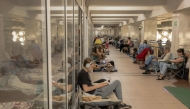 People take shelter at a metro station during Russian air attacks in Kyiv on August 21, 2025, amid the Russian invasion of Ukraine. (Photo by Roman Pilipey / AFP)