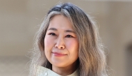 This picture taken on August 21, 2025 shows Korean Canadian director Maggie Kang, who created and co-directed Netflix's currently most popular animated film 