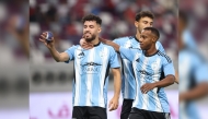Al Wakrah’s Amine Zouhzouh (left) celebrates with teammates after converting a penalty against Al Duhail.  