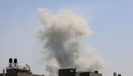 Smoke billows after an Israeli strike on Jabalia in the northern Gaza Strip on August 24, 2025. (Photo by Omar Al-Qattaa / AFP)
