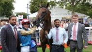 The connections of Wathnan Racing’s Silawi celebrate alongside the victorious five-year-old gelding after his commanding win yesterday.