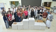 WCM-Q  new students took part in a hands-on initiative by packing donation boxes.