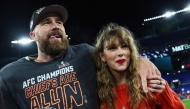 Travis Kelce #87 of the Kansas City Chiefs (L) celebrates with Taylor Swift after defeating the Baltimore Ravens in the AFC Championship Game at M&T Bank Stadium on January 28, 2024 in Baltimore, Maryland. Photo by Patrick Smith / GETTY IMAGES NORTH AMERICA / AFP
