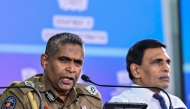 Sri Lanka's Inspector General of Police Priyantha Weerasooriya (L) speaks as Minister of Public Security Ananda Wijepala looks on during a press conference in Colombo on August 28, 2025. Photo by Ishara S. KODIKARA / AFP