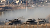 Israeli army main battle tanks move along the border with the Gaza Strip in southern Israel on August 27, 2025. Photo by Jack GUEZ / AFP.