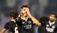 Al Sadd's Roberto Firmino celebrates after scoring a goal against Al Gharafa yesterday.