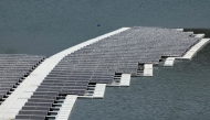 A floating photovoltaic solar installation in put in place on the Oued Rmel dam, as part of a solar pannel farm near the Tanger Med port in the province of Fahs-Anjra, west of the city of Tangiers on August 7, 2025. (Photo by Abdel Majid Bziouat / AFP)