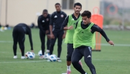 Qatar U-20 players during a training session yesterday.