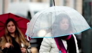 People walk against rainfall in Riga, Latvia, Aug. 26, 2025. (Photo by Edijs Palens/Xinhua)
