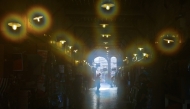 People visit the Souq Waqif bazaar on a humid and hot day in Doha on July 24, 2025. (Photo by Karim Jaafar/ AFP)