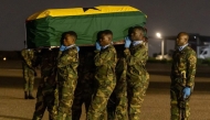 Soldiers carry a coffin of the deceased at the Air Force Base in Accra, Ghana, on Aug. 6, 2025. The Presidency of the Republic of Ghana/Handout via Xinhua