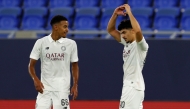 Al Sadd’s Yamaan Jarrar (right) celebrates with teammate Abdulrahman Bakri Al-Ameen during the match. 