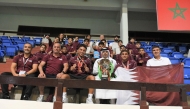 Qatar Swimming Federation President Mubarak bin Ali Al-Nuaimi celebrates with the swimmers and officials.