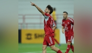 Al Arabi's Salem Reda celebrates after scoring a goal.