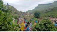 This handout image made available by the Sudan Liberation Movement/Army (SLM), on September 1, 2025, shows people inspecting the debris after a landslide devastated the village of Tarasin in Sudan's Jebel Marra area. (Photo by SUDAN LIBERATION MOVEMENT/ARMY / AFP)