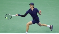 Jannik Sinner of Italy returns a shot against Lorenzo Musetti of Italy during their Men's Quarterfinal match on Day Eleven of the 2025 US Open. Matthew Stockman/Getty Images/AFP 
 