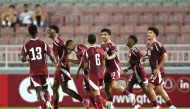 Qatar U-23 players celebrate a goal against Brunei. 