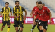 Rodrigo (right) in action during the QSL Cup match against Qatar SC at Saoud Bin Abdulrahman Stadium yesterday.