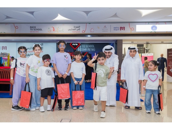 Children with gifts at the Back-to-School event by Qatar Rail.
