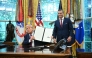 US President Donald Trump shows a signed executive order next to the Secretary of Defense Pete Hegseth in the Oval Office of the White House in Washington, DC on September 5, 2025. (Photo by Mandel Ngan / AFP)