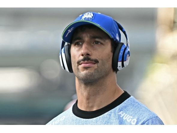 RB's Australian driver Daniel Ricciardo arrives for the drivers' parade before the Formula One Singapore Grand Prix night race at the Marina Bay Street Circuit in Singapore on September 22, 2024. (Photo by Lillian SUWANRUMPHA / AFP)

