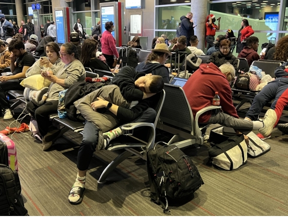 Passengers wait to board a Southwest flight in Dallas on Dec. 25, 2022, after the flight was delayed six hours because of a shortfall of flight attendants. The flight was then canceled. Photo credit: John McDonnell/The Washington Post
