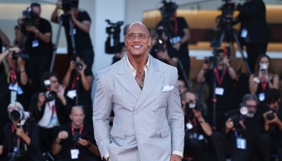Dwayne Johnson poses at the red carpet before the premiere of the film 