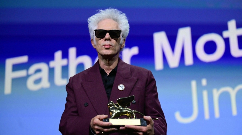 US director Jim Jarmusch poses with the Golden Lion for Best Film he reveived for 'Father Mother Sister Brother' during the award ceremony of the 82nd Venice Film Festival on September 6, 2025 at Venice Lido. (Photo by Tiziana FABI / AFP)
