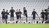Qatar players take part in a training session yesterday.