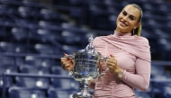 Aryna Sabalenka poses with the championship trophy after defeating Amanda Anisimova of the United States in the Queens borough of New York City. Sarah Stier/Getty Images/AFP
