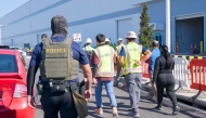 This handout photo released by US Immigration and Customs Enforcement (ICE) on September 5, 2025 allegedly shows a Homeland Security Investigations police officer during a federal search warrant at a company in Ellabell, Georgia, on September 4, 2025. (Photo by US Immigration and Customs Enforcement / AFP) 