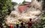 Rescue teams pull down unstable remains of a community Islamic study hall building with ropes after it collapsed while female Muslims were conducting studies in Bogor, West Java, on September 7, 2025. Photo by ADITYA AJI / AFP